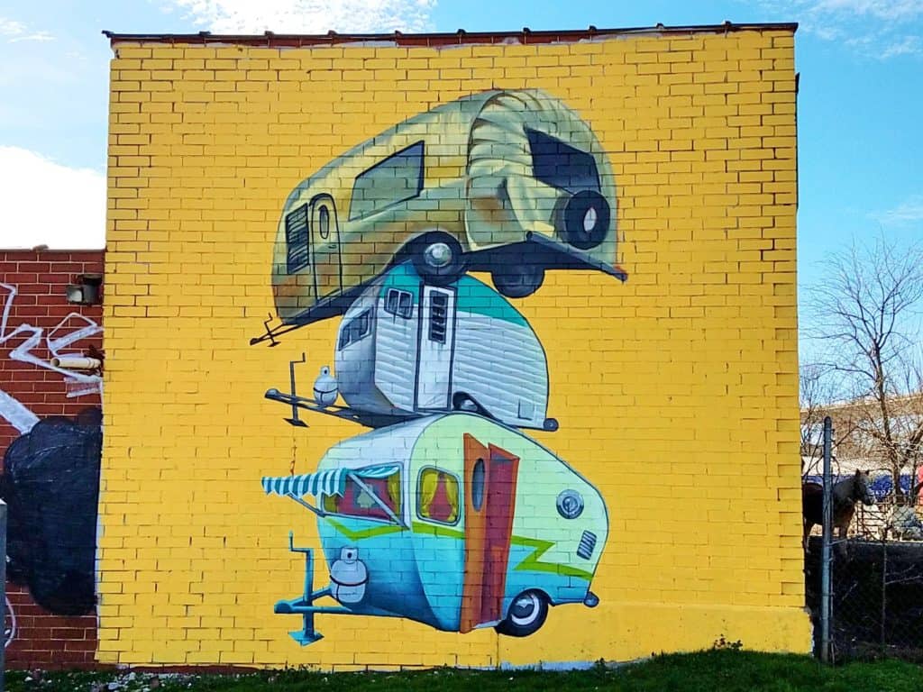 Street Art Mural in Adair Park Atlanta by Jarrett Becke artist featuring 3 stacked trailers