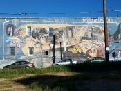 R. L. Gordon & H. R. Escalada<br/>2011 - 2019<br/><span style= "font-size: 6pt">33.77202056601376, -84.2926349270423</span> building facade mural formerly in Decatur, Georgia by R. L. Gordon & H. R. Escalada featuring a sleeping person