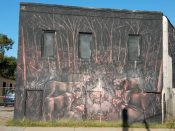 Jaz (Franco Fasoli)<br/>2013 - 2023<br/><span style= "font-size: 6pt">33.74752858425661, -84.35047710611717</span> street art mural formerly in Reynoldstown Atlanta featuring Cows gathered around a fire by Jaz (Franco Fasoli)