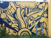 Peter Ferrari<br/>2016 - 2020<br/><span style= "font-size: 6pt">33.746599, -84.367172</span> Street art mural formerly in Cabbagetown Atlanta by Peter Ferrari featuring a black and yellow abstract pattern
