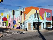 Yoyo Ferro<br/>2016 - 2026<br/><span style= "font-size: 6pt">33.65345055945799, -84.44961506264983</span> Street art mural building facade formerly in College Park Georgia by Yoyo Ferro featuring an abstract pattern in the blind contour drawing style