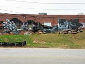 Mr. Totem 2<br/>2014? - 2019<br/><span style= "font-size: 6pt">33.7604641322701, -84.33141365162378</span> Street Art Mural formerly in Edgewood Atlanta by Mr. Totem 2 featuring a person wearing a respirator