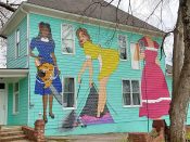 Erica Arndts<br/>2017 - 2024<br/><span style= "font-size: 6pt">33.74192946904231, -84.34623927229025</span> Street Art mural formerly in East Atlanta Villageby Erica Arndts featuring three housewives who are burlesque performers at night