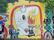 Loudermilk and Moon<br/>2018 - 2023<br/><span style= "font-size: 6pt">33.75154599355054, -84.36633027981968</span> Forward Warrior mural formerly in Cabbagetown Atlanta by Loudermilk and Moon featuring a figure sitting under a red arch