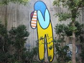 Yoyo Ferro<br/>2018 - 2022<br/><span style= "font-size: 6pt">33.751806019340144, -84.36515727900965</span> Forward Warrior mural formerly in Cabbagetown Atlanta by Yoyo Ferro featuring a figure wearing yellow overalls