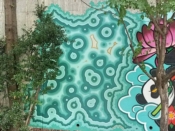 <br/>2018 - 2020<br/><span style= "font-size: 6pt">33.75184808565116, -84.3650085386718</span> Forward Warior Mural formerly in Cabbagetown Atlanta by Faye Bell featuring a green pattern