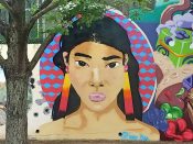 Austin Blue<br/>2018 - 2019<br/><span style= "font-size: 6pt">33.751511076696616, -84.36644774059864</span> Forward Warrior mural formerly in Cabbagetown Atlanta by Austin Blue featuring a woman with black hair