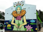 Sanithna Phansavanh<br/>2017 - 2022<br/><span style= "font-size: 6pt">33.853971469565984, -84.3160640052855</span> Street Art Mural formerly on Buford Highway in Atlanta by Sanithna Phansavanh featuring a person among water lillies.