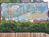 William Mitchell<br/>2015 - 2022<br/><span style= "font-size: 6pt">33.789605584242146,-84.36996951699257</span> Street Art Mural formerly on the Atlanta BeltLine in Morningside-Lenox Park by William Mitchell featuring a fish and the words "visit amsterdam walk"