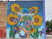 Debbi Snax<br/>2017 - 2019<br/><span style= "font-size: 6pt">33.75070750928427, -84.39635282566502</span> Street Art Mural formerly in Downtown Atlanta by Debbie Snax featuring flowers