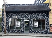 Travis Love<br/>2018 - 2024<br/><span style= "font-size: 6pt">33.75423879221533, -84.37282738444738</span> building facade mural formerly in Sweet Auburn Atlanta by Travis Love featuring a black and white pattern