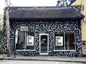 Travis Love<br/>2018 - 2024<br/><span style= "font-size: 6pt">33.75423879221533, -84.37282738444738</span> building facade mural formerly in Sweet Auburn Atlanta by Travis Love featuring a black and white pattern