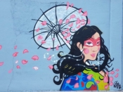 OG WAR$<br/>2018 - 2019<br/><span style= "font-size: 6pt"> 33.73487645586229, -84.40821764865996</span> Street Art Mural formerly in Adair Park Atlanta by OG War$ featuring a woman with a parasol