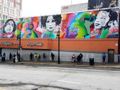 Jo DiBona<br/>2017 - 2026<br/><span style= "font-size: 6pt">33.75319361249048, -84.39152440023146</span> Street Art Mural formerly in Southwest Downtown Atlanta by Jo DiBona featuring three faces on a colorful background - created for Elevate Atlanta
