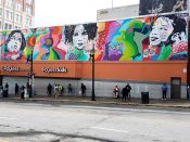 Jo DiBona<br/>2017 - 2026<br/><span style= "font-size: 6pt">33.75319361249048, -84.39152440023146</span> Street Art Mural formerly in Southwest Downtown Atlanta by Jo DiBona featuring three faces on a colorful background - created for Elevate Atlanta