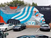 Sanithna Phansavanh<br/>2018 - 2018<br/><span style= "font-size: 6pt">33.754568051876156, -84.3792111444032</span> Street Art Mural formerly in Downtown Atlanta by Sanithna Phansavanh featuring a face with blue and white hair