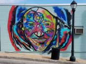 Corey Barksdale<br/>2018 - 2023<br/><span style= "font-size: 6pt">33.72230329175901, -84.46414916852588</span> Street Art Mural formerly in Southwest Atlanta by Corey Barksdale featuring a multi-color face