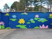 Sanithna Phansavanh<br/>2017 - 2022<br/><span style= "font-size: 6pt">33.853788301552484, -84.31564229102172</span> Street Art Mural formerly on Buford Highway in Atlanta by Sanithna Phansavanh featuring water lillies