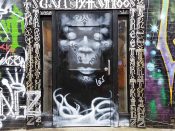 Paul Athol Lewis<br/>2019 - 2021<br/><span style= "font-size: 6pt">33.76454779570545, -84.34994784430052</span> Street Art Mural formerly in Little Five Points Atlanta by Paul Athol Lewis featuring a grey Face