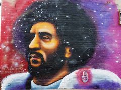 JR Outlaw<br/>2019 - 2026<br/><span style= "font-size: 6pt">33.75071979619989, -84.39598003078744</span> Street Art Mural formerly in downtown Atlanta by J.R. Outlaw featuring Colin Kaepernick