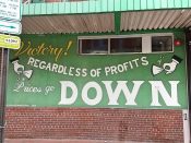 Will Mitchell<br/>2017 - 2019<br/><span style= "font-size: 6pt">33.75226490036316, -84.39279248184764</span> Street Art mural formerly in Downtown Atlanta by Will Mitchell featuring "regardless of profits"