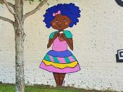 ImaniJC<br/>2019 - 2024<br/><span style= "font-size: 6pt">33.73458070799746,-84.34909199407235</span> Street Art Mural formerly in East Atlanta Village by ImaniJC featuring a girl drinking coffee