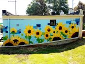 Alannah Vincent<br/>2019 - 2019<br/><span style= "font-size: 6pt">33.75453244215521, -84.41302769224149</span> Mural formerly at the Atlanta University Center by Alannah Vincent featuring sunflowers