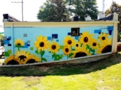 Alannah Vincent<br/>2019 - 2019<br/><span style= "font-size: 6pt">33.75453244215521, -84.41302769224149</span> Mural formerly at the Atlanta University Center by Alannah Vincent featuring sunflowers