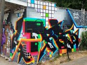 ill.des (David Fratu) and Letsgopaint (Matt Letrs)<br/>2019 - 2025<br/><span style= "font-size: 6pt">33.76905146510213, -84.40495752194349</span> Street Art Mural formerly in English Avenue Atlanta by ill.des (David Fratu) and Letsgopaint (Matt Letrs) featuring text on a background of squares