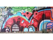 Phil Harris<br/>2019 - 2024<br/><span style= "font-size: 6pt">33.75208776073293,-84.364046528936</span> Street Art Mural formerly in Cabbagetown Atlanta by Phil Harris featuring red arcs and capsuals