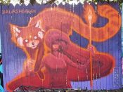 Amy Ashbaugh<br/>2019 - 2020<br/><span style= "font-size: 6pt">33.751846523184334, -84.36495924636422</span> Street Art Mural formerly in Cabbagetown Atlanta by Amy Ashbaugh featuring a woman and a racoon