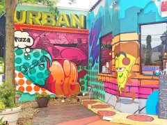 Letsgopaint (Matt Letrs)<br/>2020 - 2025<br/><span style= "font-size: 6pt">33.75128194378967, -84.32190417977965</span> Street Art Mural in Kirkwood Atlanta by Letsgopaint (Matt Letrs) featuring a pizzeria scene