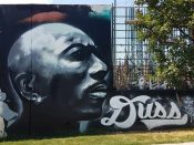 Lonnie Garner<br/>2020 - 2021<br/><span style= "font-size: 6pt">33.752427, -84.362647</span> Street Art Mural formerly in Cabbagetown Atlanta by Lonnie Garner featuring a face with an earring