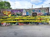 Sever<br/>2020 - 2021<br/><span style= "font-size: 6pt">33.75190082013724, -84.36344591952702</span> Street Art Mural formerly in Cabbagetown Atlanta by Sever featuring yellow caution tape