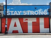 Tes Arlette<br/>2020 - 2023<br/><span style= "font-size: 6pt">33.78169926080125,-84.38019698533515</span> Street Art Mural formerly in Midtown Atlanta by Tes Arlette featuring "Stay Strong ATL"