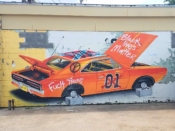 Sever<br/>2020 - 2022<br/><span style= "font-size: 6pt">33.72697207090204, -84.41804192002495</span> Street Art Mural formerly in Oakland City Atlanta by Sever featuring a car on blocks