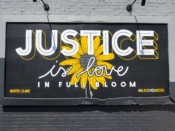 Elaine Stephenson<br/>2020 - 2024<br/><span style= "font-size: 6pt">33.75094558036409, -84.30934019057537</span> Street Art Mural formerly in East Lake Atlanta by Elaine Stephenson featuring "Justice" and a flower