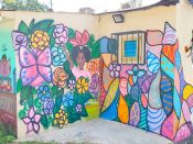 Ashley Heard & Tiffany Davis<br/>2020 - 2024<br/><span style= "font-size: 6pt">33.68089207028693, -84.38846240118386</span> Street Art Mural formerly in Southeast Atlanta by Ashley Heard and Tiffany Davis featuring a girl with a raised fist