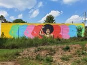 Mirage Vanguard<br/>2020 - 2023<br/><span style= "font-size: 6pt">33.733482555974994, -84.34974045960695</span> Street Art Mural formerly in East Atlanta by Mirage Vanguard featuring "We are Here" and a woman with fist in air