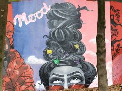 Street art Mural formerly in Cabbagetown Atlanta by Dizzy featuring a woman with tall hair
