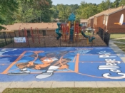 Chozen<br/>2020 - 2022<br/><span style= "font-size: 6pt">33.6562236815265, -84.45469185357615</span> Basketball Court Mural formerly in College Park Atlanta by Chozen featuring a basketball player