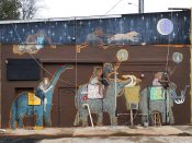 Artist ?<br/>2011? - 2024<br/><span style= "font-size: 6pt">33.761661444427446, -84.24934421005267</span> Street Art Mural formerly in Belvedere Park Atlanta by an unknown artist featuring cave people