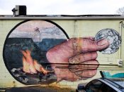 NanookNanook<br/>2013 - 2023<br/><span style= "font-size: 6pt">33.75931727079236, -84.30409738646934</span> Street Art Mural formerly in Oakhurst Atlanta by Nanook featuring a hand holding a coin