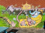 Smilin Death (Geoffrey Solomon)<br/>2021 - 2022<br/><span style= "font-size: 6pt">33.73139014482255, -84.42177311122916</span> Street Art Mural formerly on the Beltline in West End Atlanta by Smilin Death (Geoffrey Solomon) featuring a opossum playing a guitar