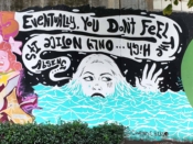 Courtney Hicks<br/>2021 - 2022<br/><span style= "font-size: 6pt">33.752034907412366, -84.36421416699942</span> Street Art Mural formerly in Cabbagetown Atlanta by Courtney Hicks featuring a woman in water