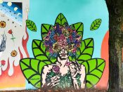 Alea Hurst<br/>2021 - 2024<br/><span style= "font-size: 6pt">33.75152125517264, -84.36642293412484</span> Street Art Mural formerly in Cabbagetown Atlanta by Alea Hurst featuring a woman with flowers on her head