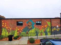 Danae Antoine<br/>2021 - 2026<br/><span style= "font-size: 6pt">33.726313535033206, -84.37697908364092</span> Street Art Mural formerly in Grant Park Atlanta by Danae Antoine featuring a woman among plants