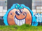 Atomik<br/>2022? - 2024<br/><span style= "font-size: 6pt">33.68844324432901, -84.4399893374196</span> Street Art Mural formerly in East Point Atlanta by Atomik featuring a smirking orange