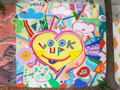 Street Art Mural formerly in Cabbagetown Atlanta by Kevin Bongang featuring a heart saying "look up"