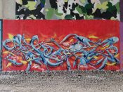 Artist ?<br/>2022 - 2023<br/><span style= "font-size: 6pt">33.80874608485197, -84.37760961550016</span> Graffiti piece formerly on the Beltline in Buckhead Atlanta by an unknown artist featuring a grey pattern on a red background